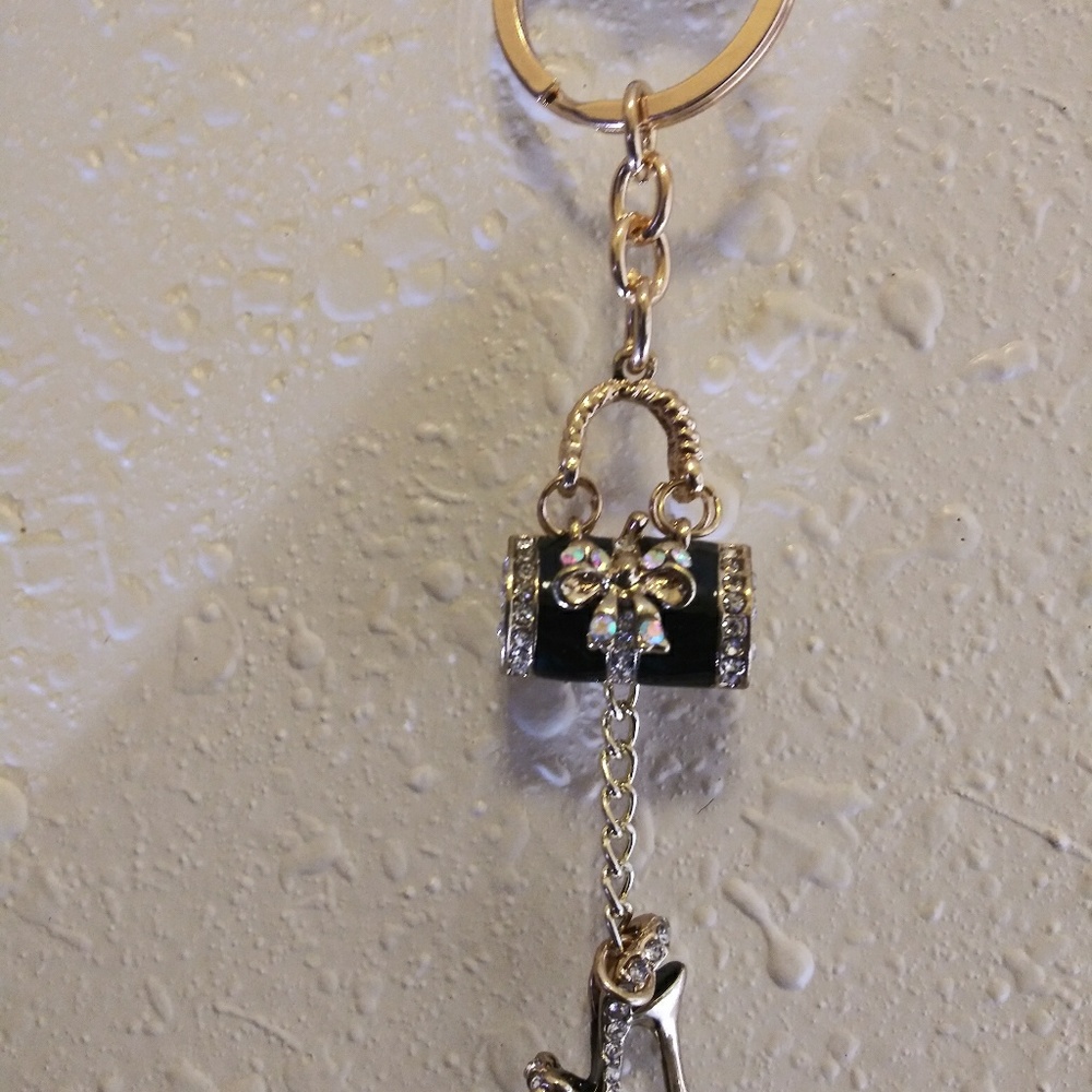 Black and gold diamond purse with a sexy stiletto